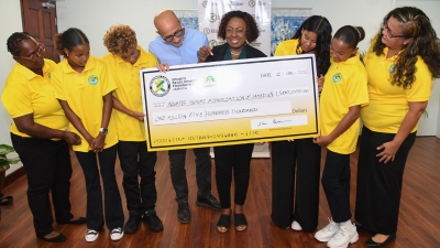 he Minister of Culture, Gender, Entertainment and Sport, the Honourable Olivia Grange (centre), with the General Manager of the Sport Development Foundation, Alan Beckford and Manager of the Jamaica Goodwill Swimming Championship Team, Christina Chuck Smith (right) during a cheque presentation ceremony on Tuesday, 12 August 2025. Also pictured are members of the team which received $1.5M from the Ministry to assist with expenses.
