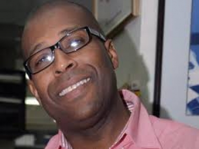 Grange expresses sorrow at death of journalist, Glenroy Sinclair