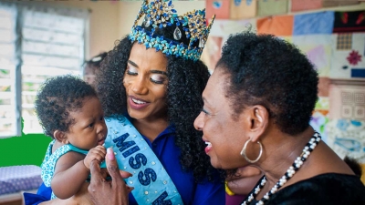 Miss World 2019, Toni-Ann Singh, with a new born at the Women&#039;s Centre of Jamaica Foundation location in Morant Bay, St Thomas. The Minister of Culture, Gender, Entertainment and Sport, the Honourable Olivia Grange shares the moment.