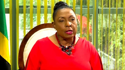 Minister gives money to Cavalier and Waterhouse for Caribbean Club Championships