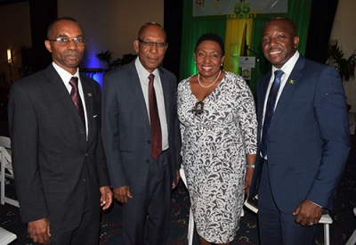 The Minister of Culture, Gender, Entertainment and Sport, the Honourable Olivia Grange, shared a photo opportunity with the Minister of State in the Ministry of National Security, Senator the Honourable Pearnel Charles Jr (left); Chief of Defence Staff Major General Rocky Meade and Honorary Consul of Barbados in Jamaica, Winston Bayley (from left) at a reception hosted by the Ministry of Foreign Affairs and Foreign Trade to mark its 55th Anniversary, Sept 5, 2017. The event was held at the Jamaica Pegasus Hotel.