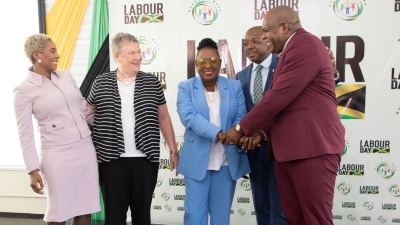 The Minister of Culture, Gender, Entertainment and Sport, the Honourable Olivia Grange (centre) shares a light moment with Minister of Labour and Social Security, the Honourable Pearnel Charles (2nd right) and Opposition Senator Floyd Morris (right) at the launch of Labour Day 2024. Also sharing the moment are Managing Director of HEART NSTA Trust, Dr Taneisha Ingleton (left) and Professor of Public Health and Ageing, the Honourable Professor Denise Eldemire-Shearer.