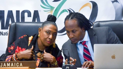 The Minister of Culture, Gender, Entertainment and Sport, the Honourable Olivia Grange, confers with Minister of State, the Honourable Alando Terrelonge during the meeting of the United Nations Committee on the Elimination of Racial Discrimination on Friday (November 25, 2022).  Minister Grange appeared before the Committee via video link.