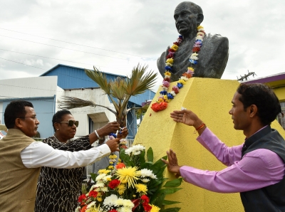 The Honourable Olivia Grange, Minister of Culture, Gender, Entertainment and Sport participates in this year’s Garlanding Ceremony held in recognition of the 150th anniversary of Mahatma Gandhi’s birth at the Jamaica Library Services Headquarters in Kingston earlier today (Tuesday). Also photographed are: His Excellency, M. Sevala Naik, India’s High Commissioner to Jamaica (left) and Gopal Lal Sharma, representative, High Commission of India, Kingston.